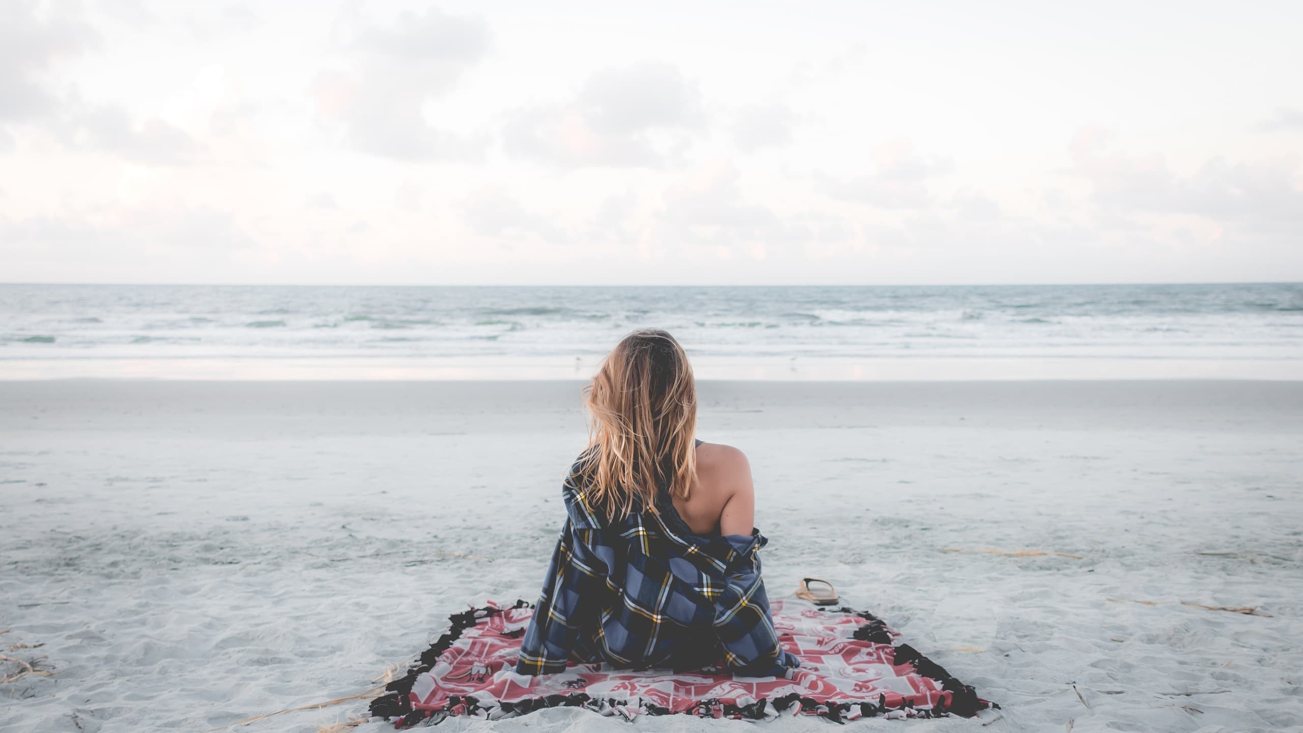 Woman on beach in autumn