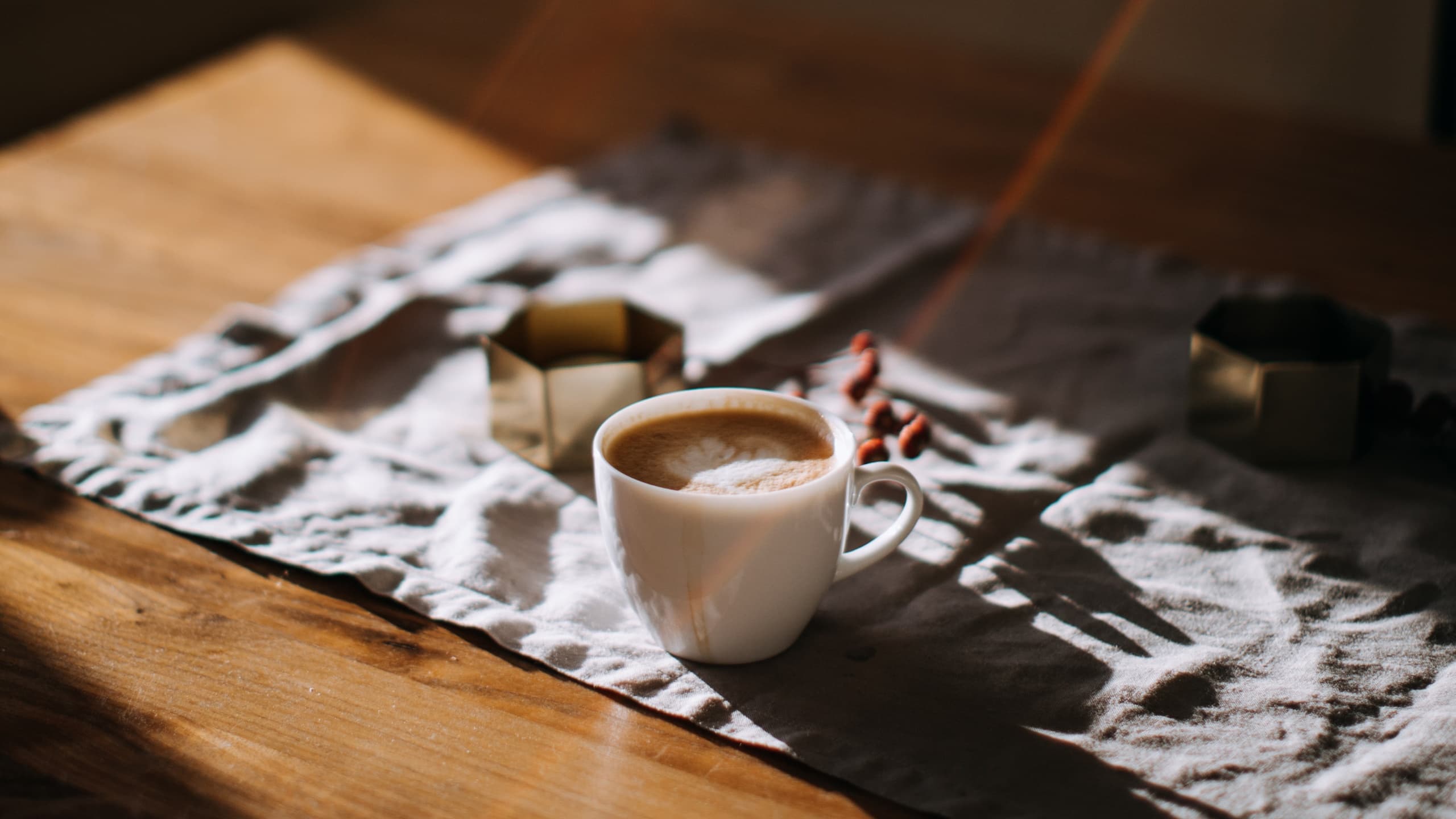 Coffee cup on table in sunlight
