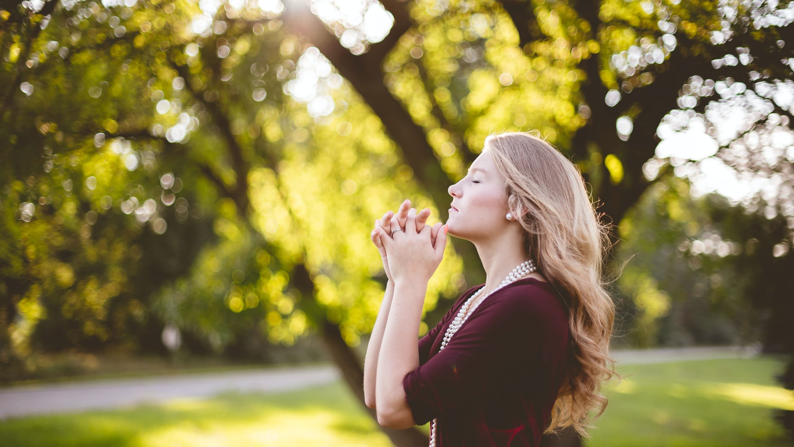 Woman meditating in park