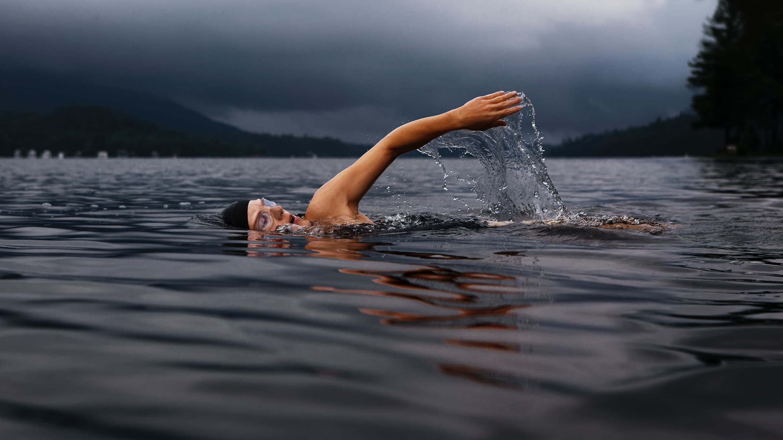 Woman swimming in lake