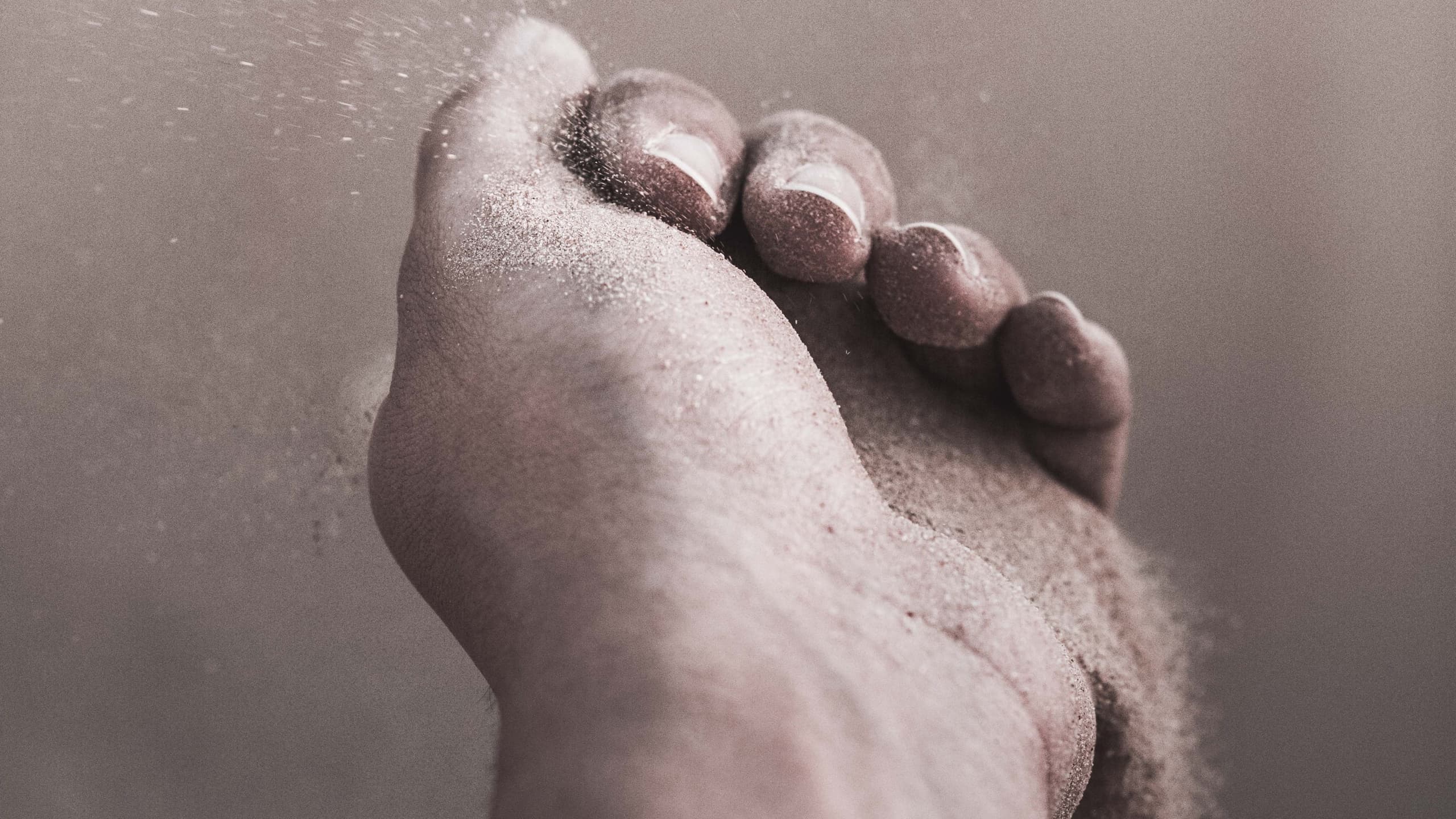 Grain of sands running through hand