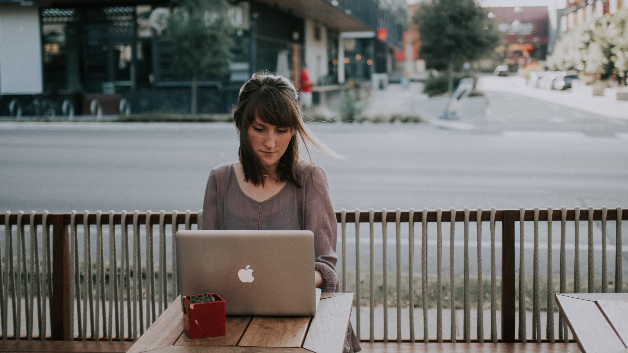 Woman working on laptop at cafe in Austin
