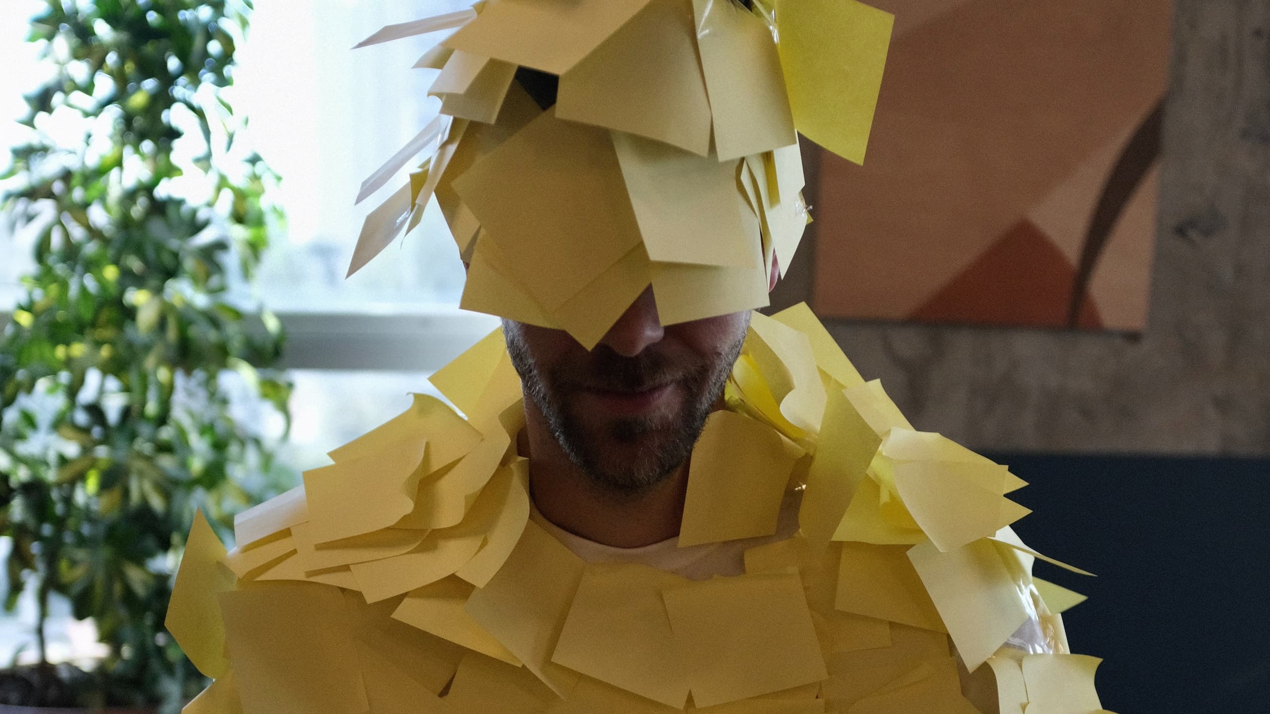 Man with post-it notes on his face