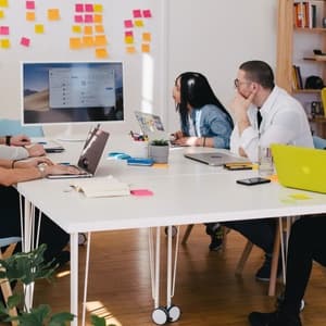 Group working together staring at screen